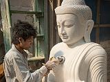 Touching up a Buddha
