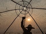 Conical net fishing on Inle Lake