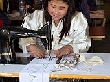 Sewing student  For beginners, the exercise is just following the line.  The sewing machine has no thread nor needle.