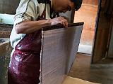 Putting a sheet on a pile