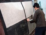 Putting sheets on hot plates to dry