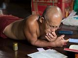 Senior monk studying  Buddhism threaded its way through our trip, partially because the countries visited are heavily Buddhist. Also, some of our guides had been monks and we visited many monasteries, temples, and shrines.  This and the next two images are from our first monastery visit.