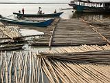 Bamboo on the Yangon River  The local people, among the poorest in the area, split and weave the bamboo to make room partitions.