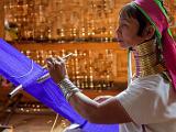 Long-necked woman weaving