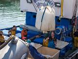 Loading ice into fishing boat  Getaria, Spain